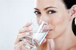 woman drinking distilled water