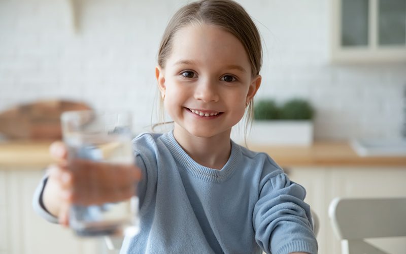 girl drinking distilled water