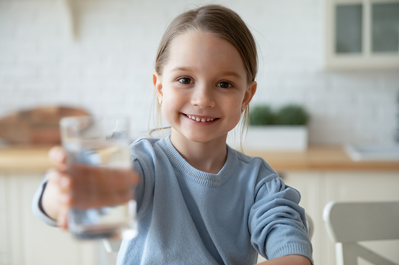 girl drinking distilled water